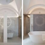Dos vistas de baño con bóveda blanca: ducha de mármol y bañera exenta frente a mosaico azul